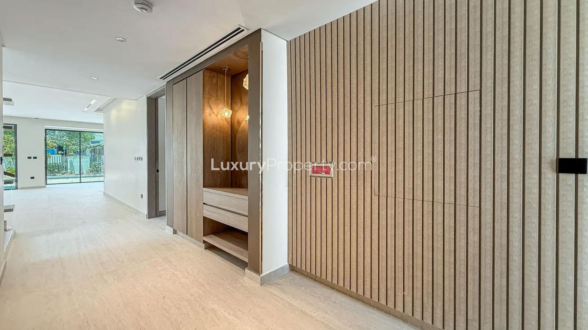 "Stylish interior of upgraded 4-bedroom villa in Harmony 3, Tilal Al Ghaf for rent.",Modern hallway in upgraded 4-bedroom villa, Harmony 3, Tilal Al Ghaf for rent