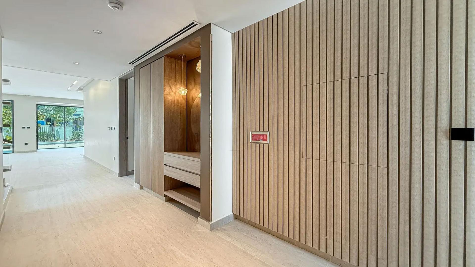 "Stylish interior of upgraded 4-bedroom villa in Harmony 3, Tilal Al Ghaf for rent.",Modern hallway in upgraded 4-bedroom villa, Harmony 3, Tilal Al Ghaf for rent