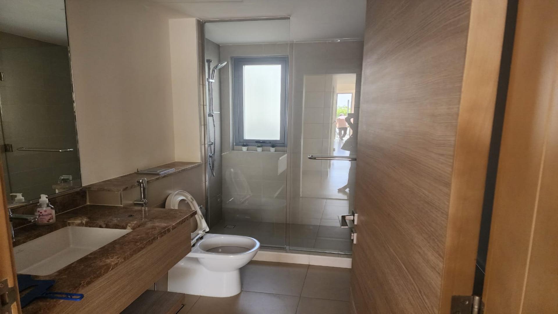 Modern bathroom with dual sinks and glass shower in Sidra I villa, Dubai Hills Estate