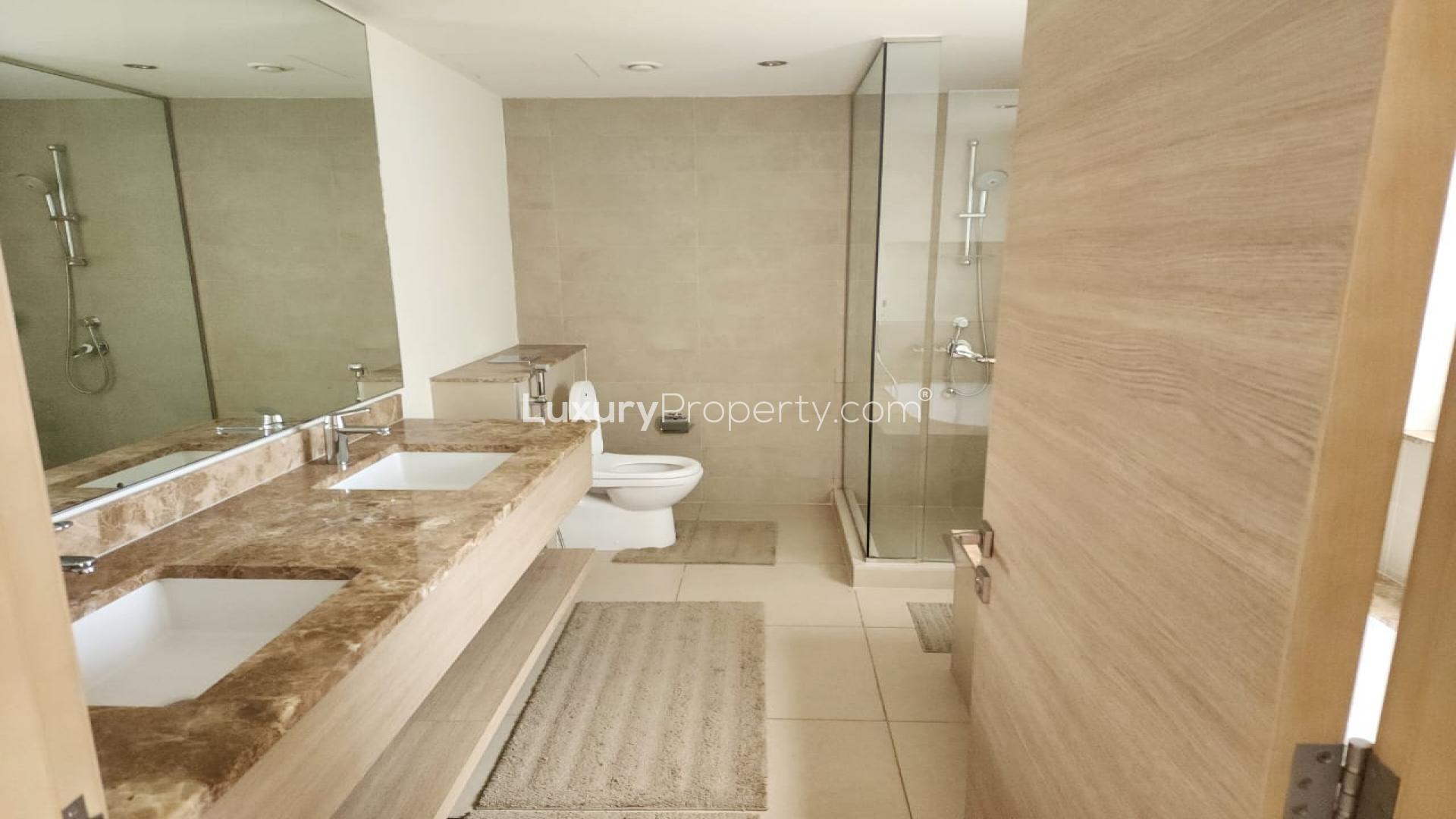 Bright bedroom with large windows and balcony view in Sidra Villas, Dubai Hills Estate