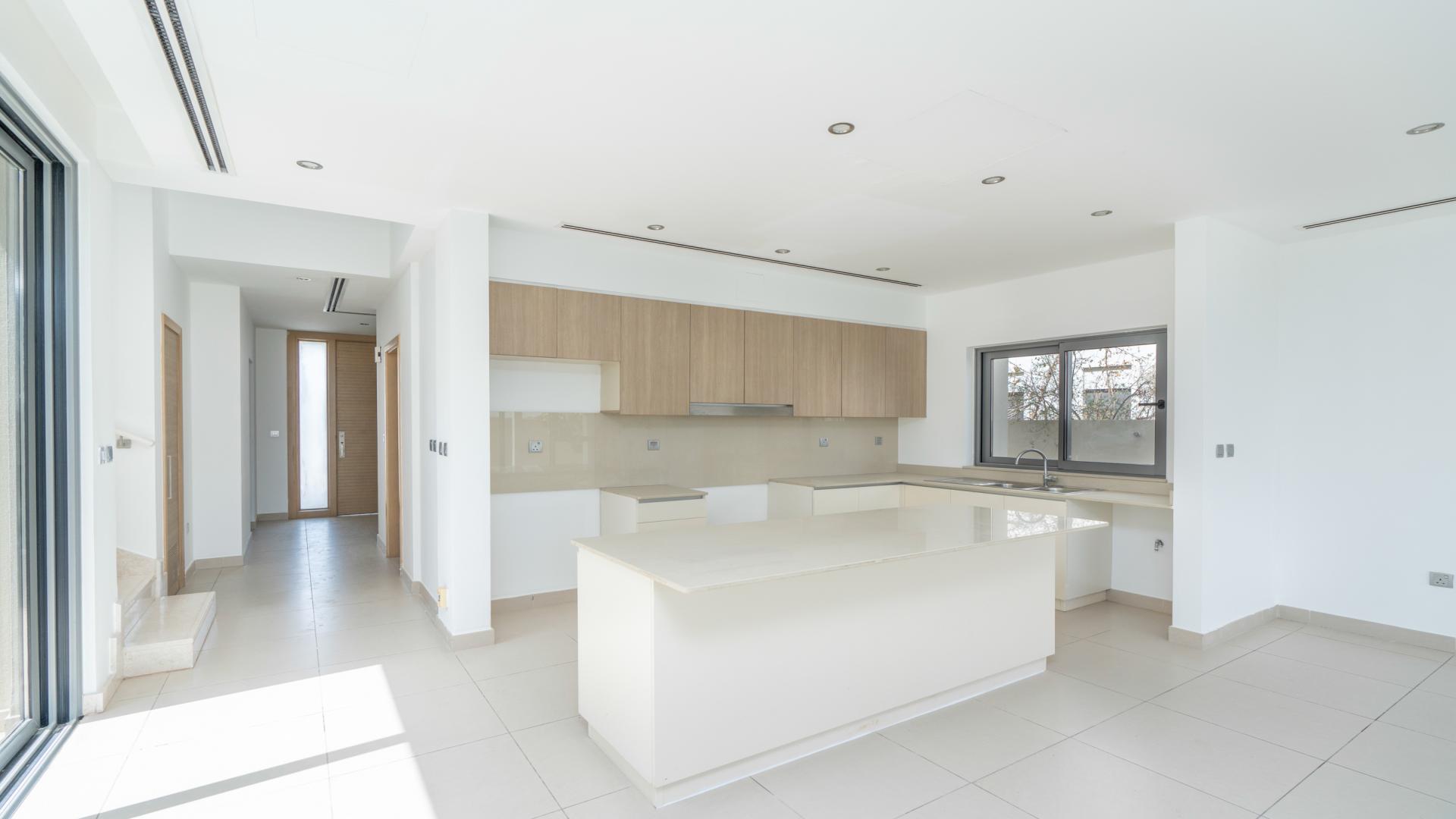 Modern kitchen with large windows in 4-bedroom villa, Sidra Villas, Dubai Hills Estate