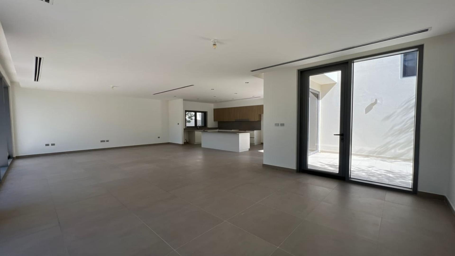 Bright living room with garden view in Dubai Hills Estate villa for rent