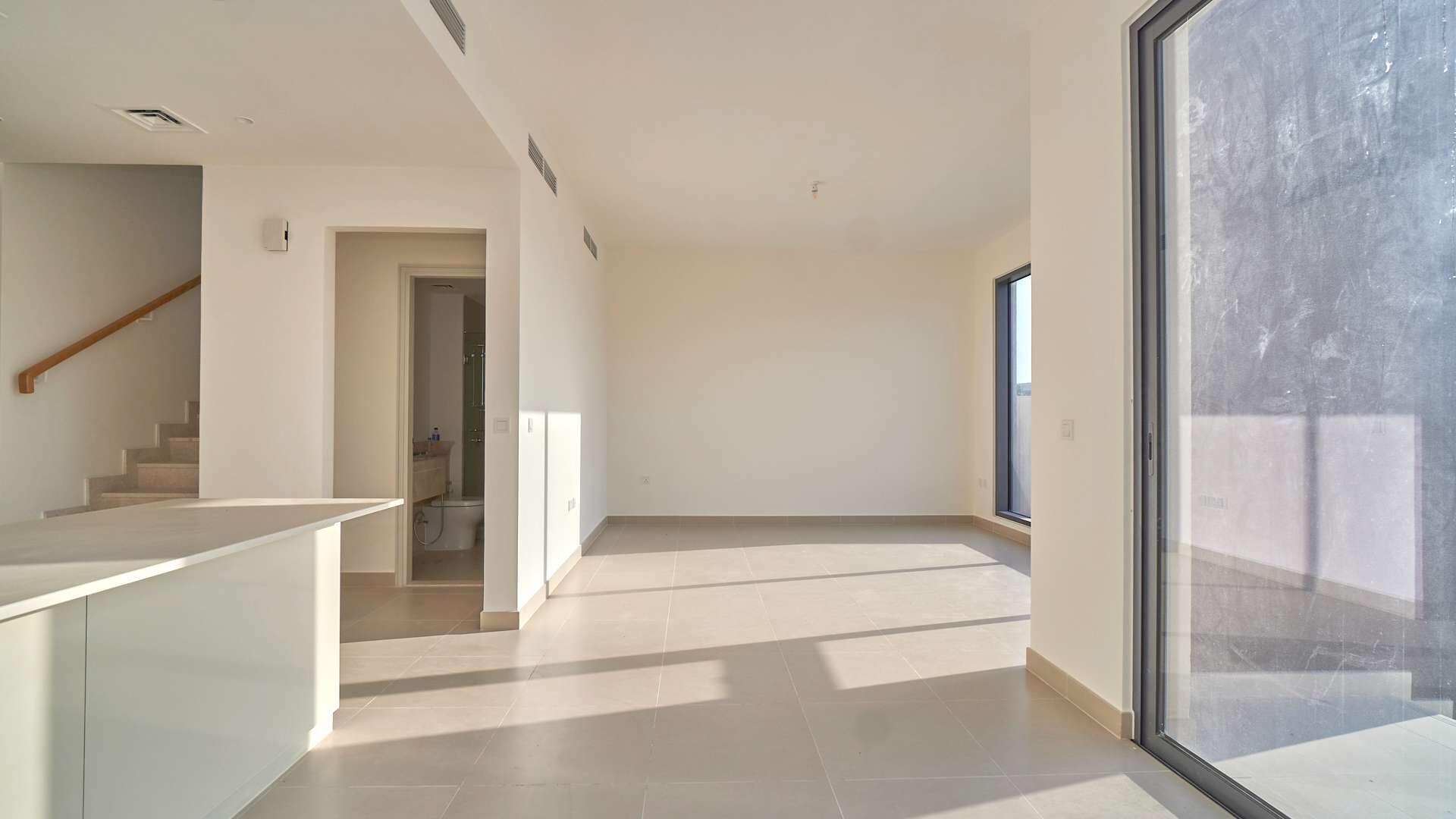 Bright living area in 4-bed townhouse, Maple at Dubai Hills Estate, with large windows