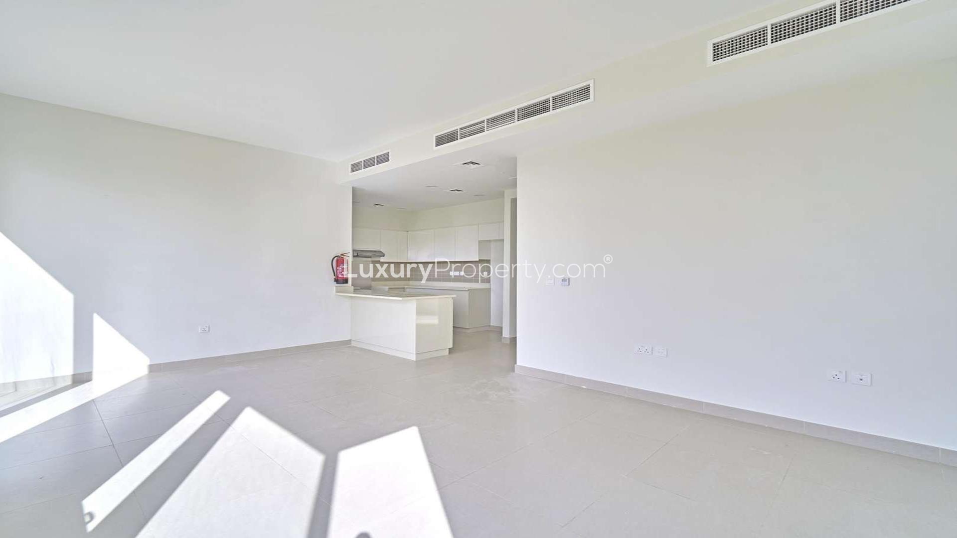 "4-bedroom corner villa exterior with garden in Maple 2, Dubai Hills Estate for rent.",Bright, modern kitchen in 4-bedroom villa, Maple 2, Dubai Hills Estate, available for rent