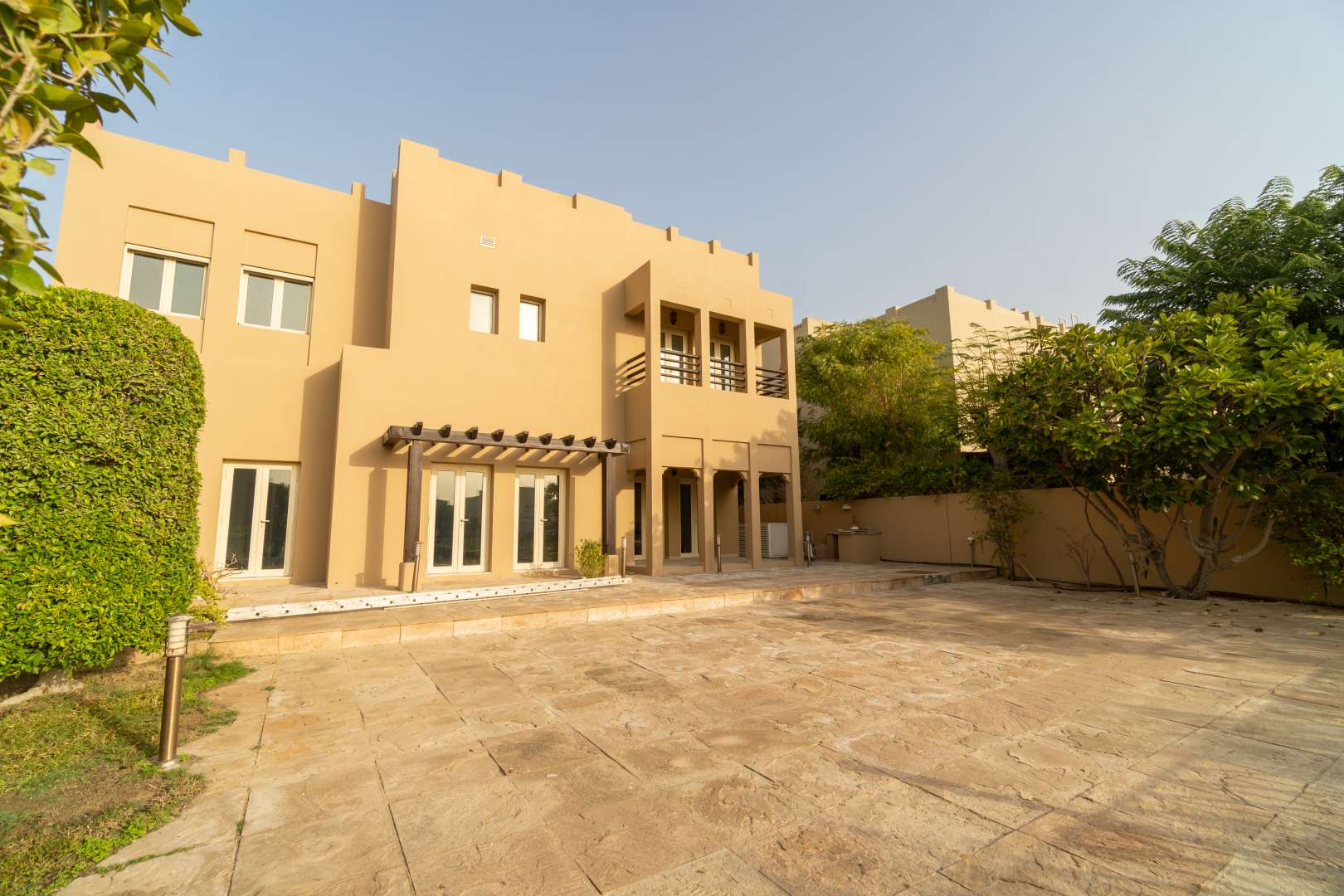 Spacious bedroom in Meadows 7 villa for rent, featuring elegant furnishings and natural light