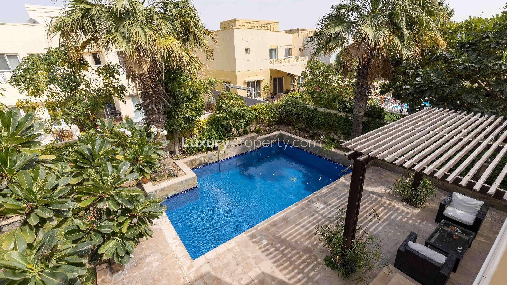 Luxurious furnished villa living room in Meadows 5 with modern sofas and stylish decor