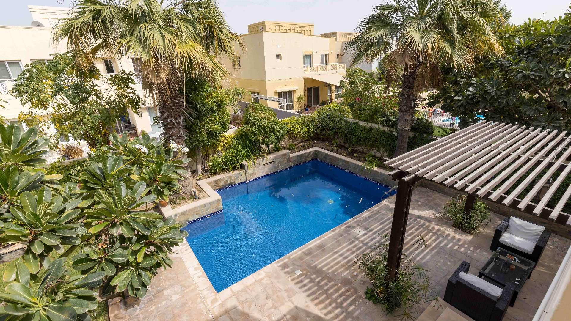 Luxurious furnished villa living room in Meadows 5 with modern sofas and stylish decor