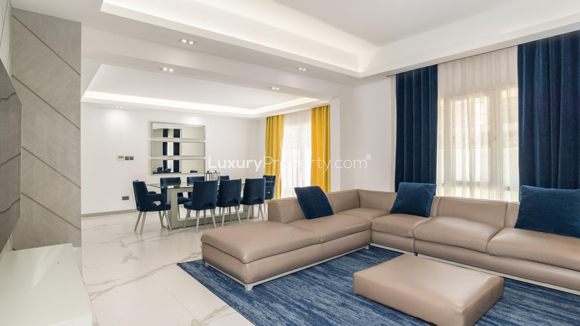Elegant living area in upgraded Meadows 5 villa, featuring modern furnishings and spacious layout