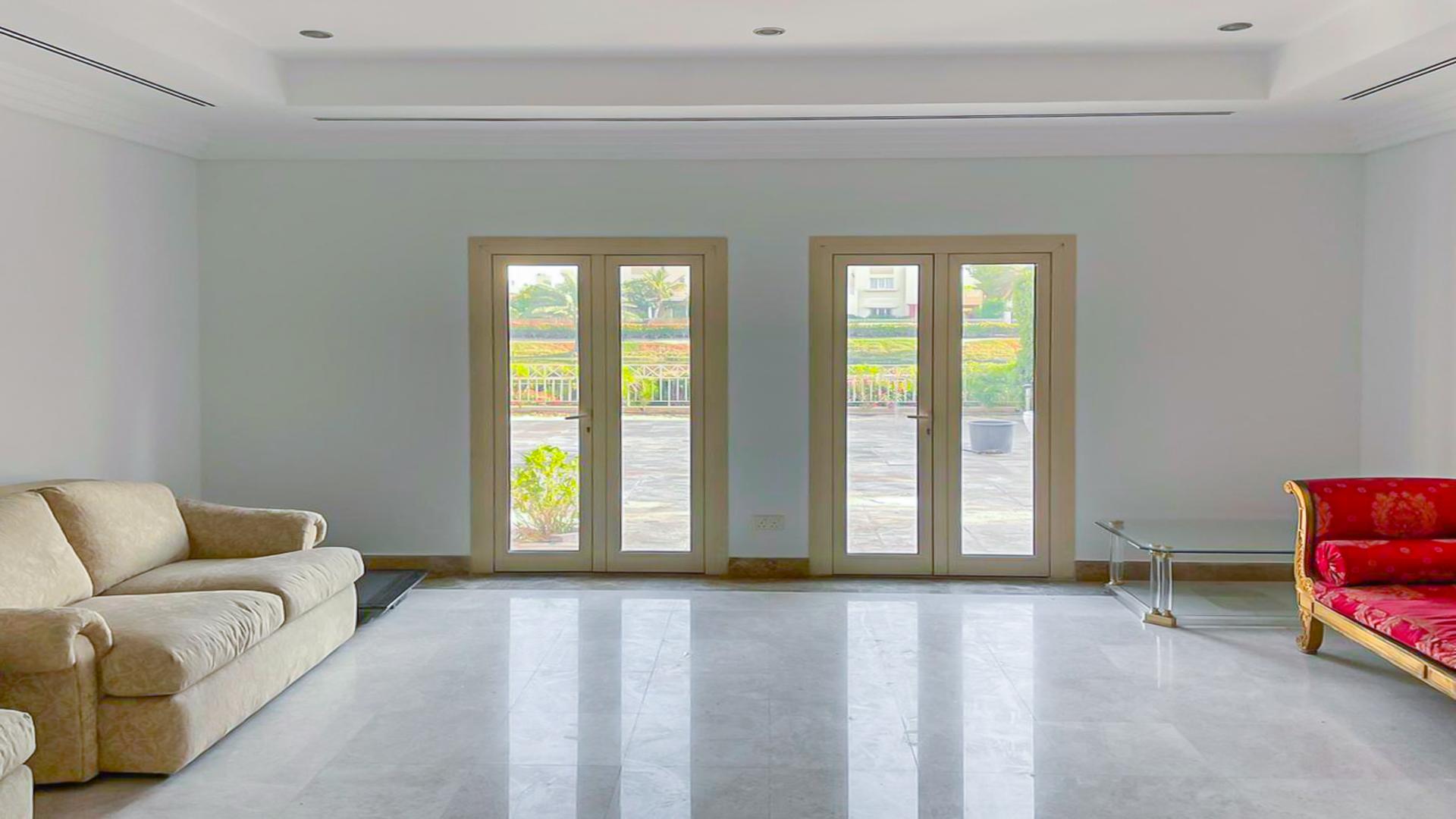 Interior view of villa with large windows, Meadows 7, lake-backing home for rent