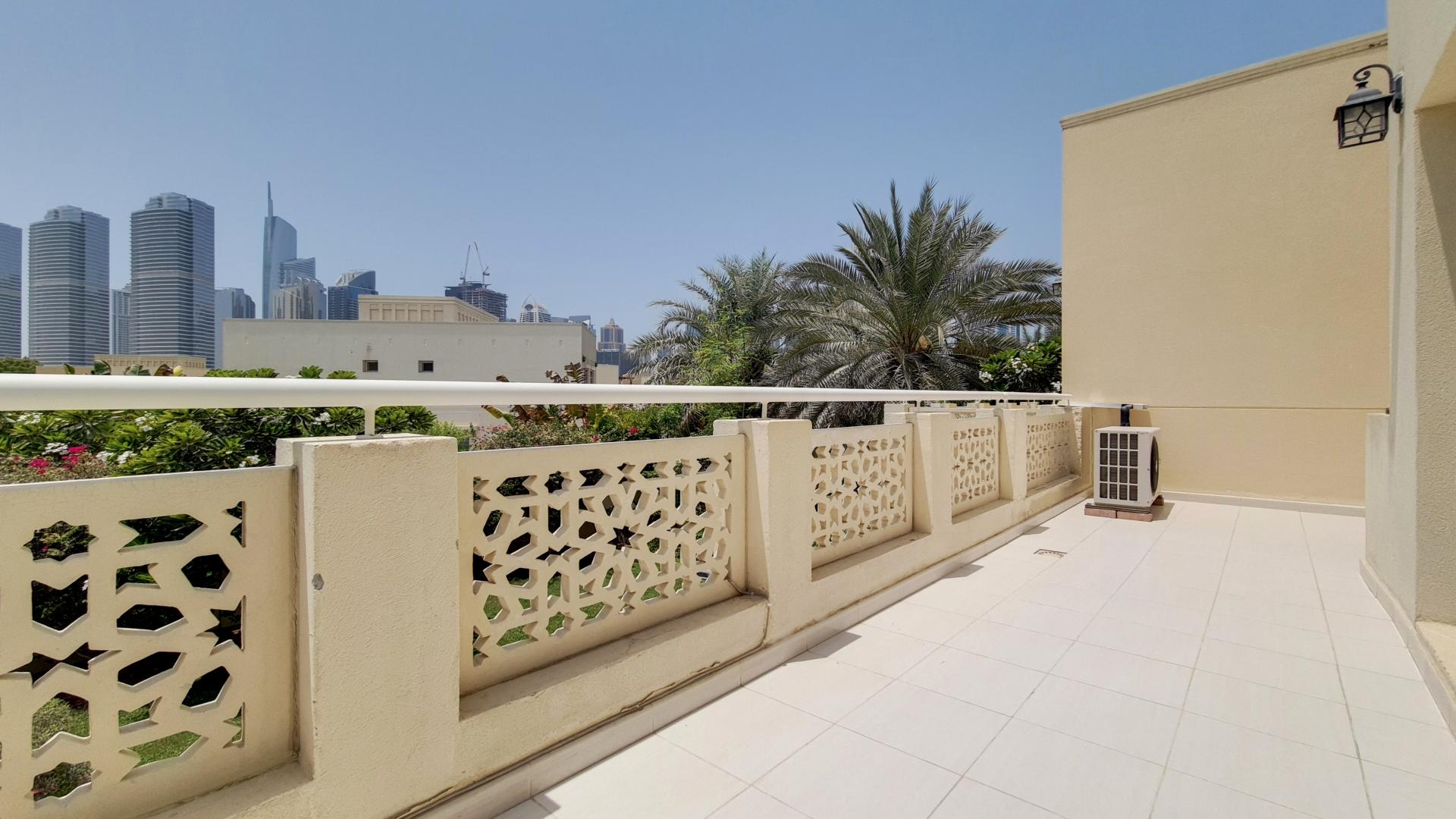 Luxurious living room in spacious Meadows 2 villa with elegant decor and ample seating