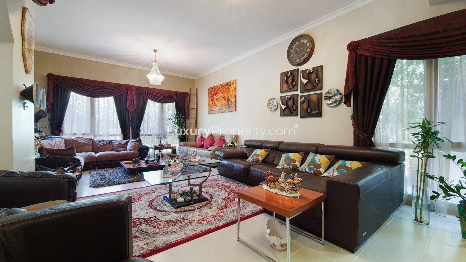 Exterior view of spacious Meadows 2 villa with gated entrance and garage in Dubai