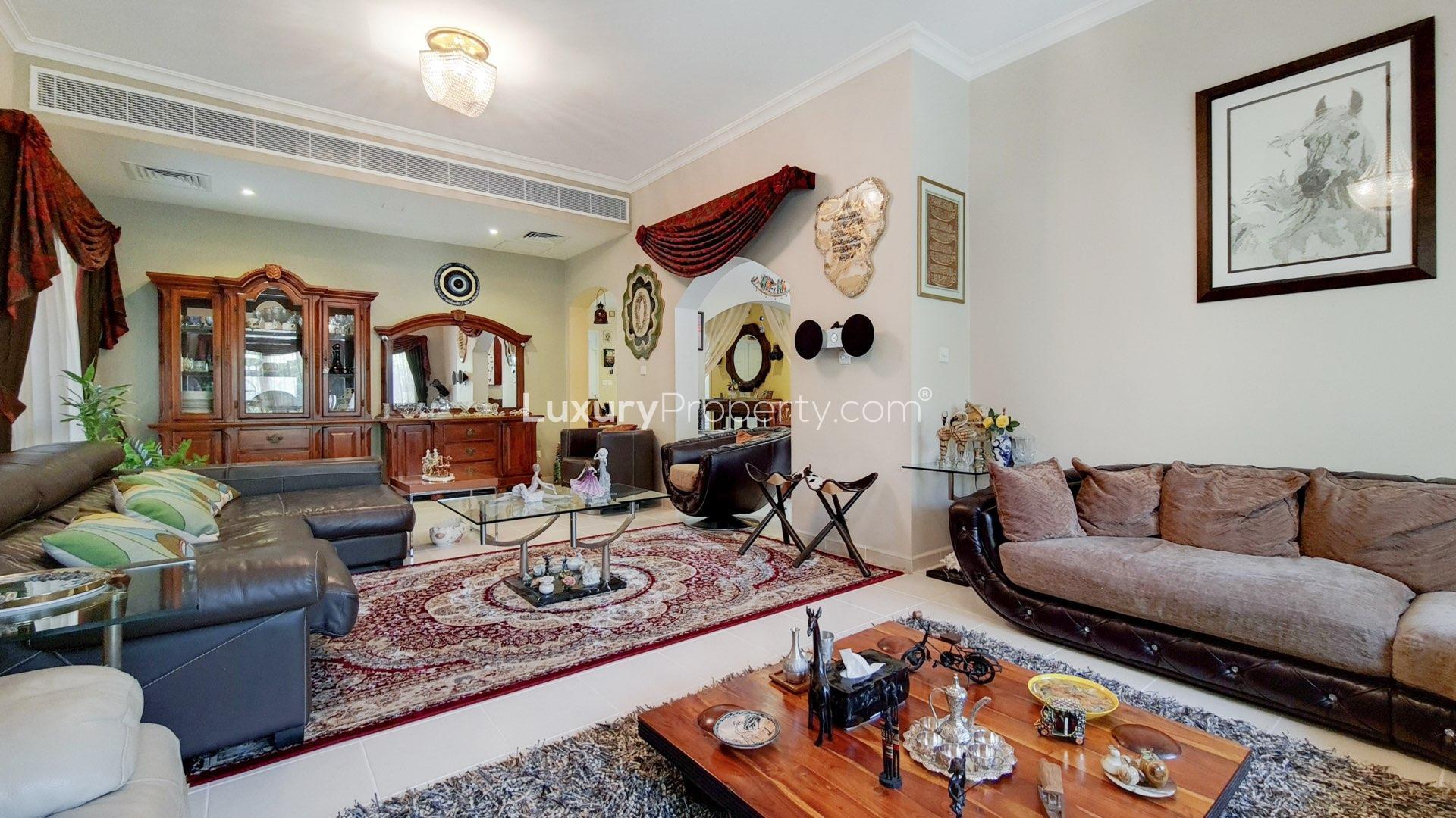 Elegant living room in Meadows 2 villa with stylish decor and large windows