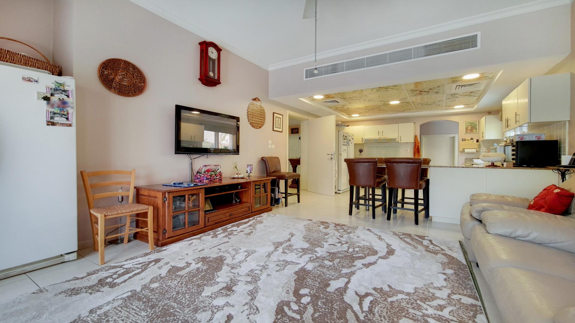 Elegant living room in Meadows 2 villa with classic decor and comfortable seating