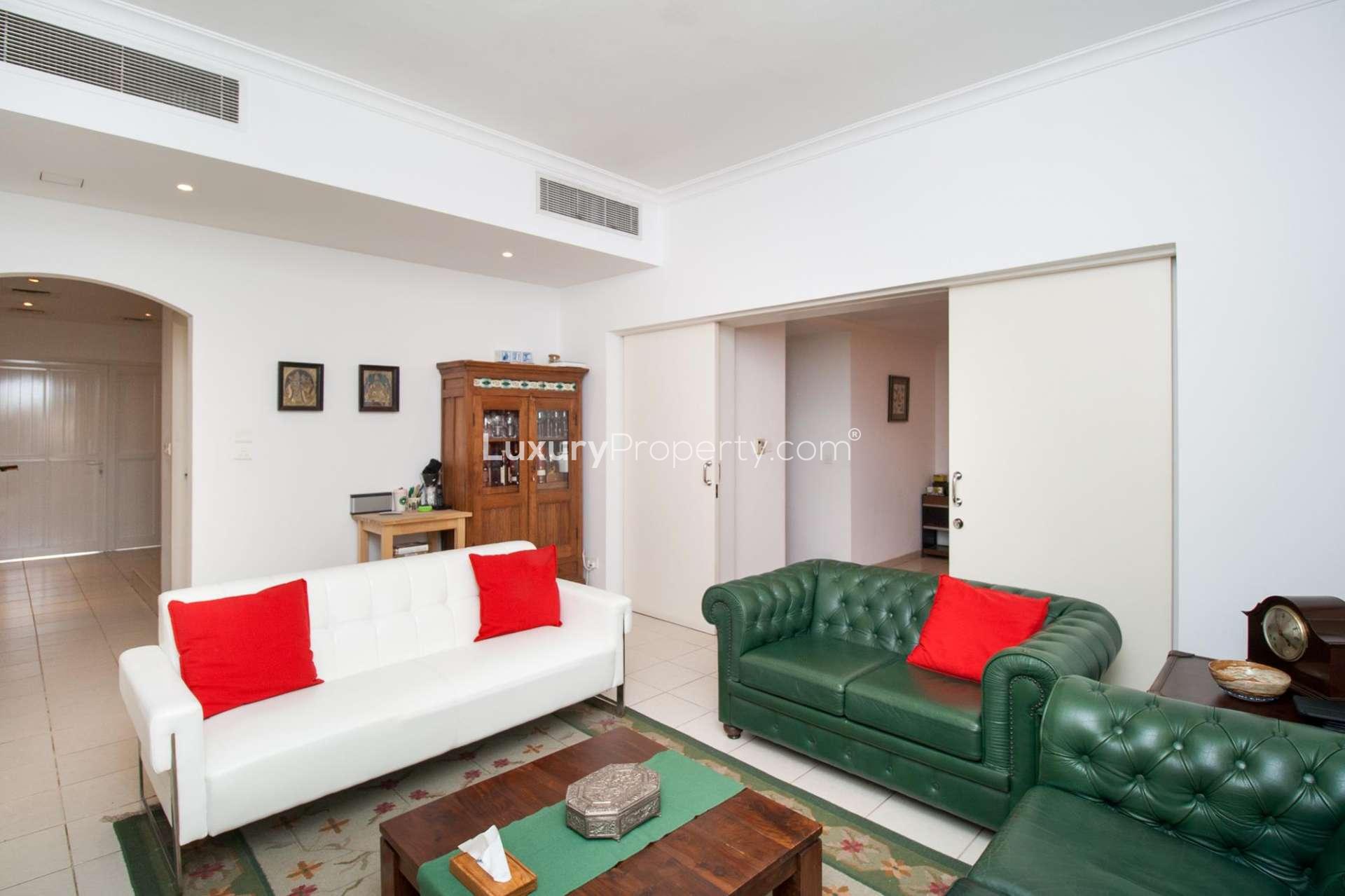 Interior of bright villa hallway in Meadows, Emirates Living with staircase and living area