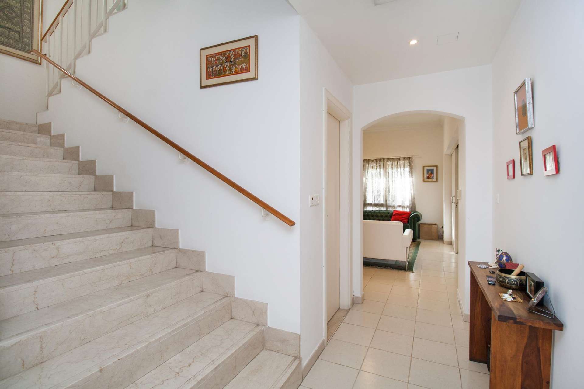 Backyard view of spacious villa in Meadows, Emirates Living, with lush greenery and patio