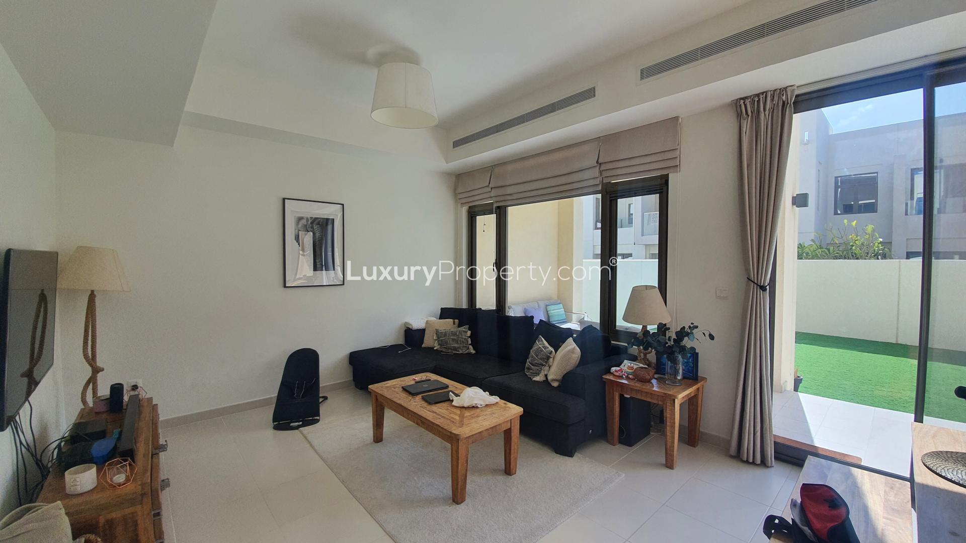 Exterior view of 4-bedroom villa in Mira Community, Reem, with garage and modern design