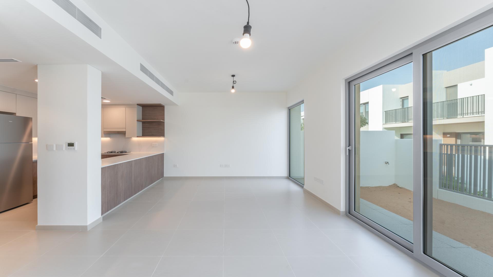 Modern kitchen and living area in Elan villa, Tilal Al Ghaf, available for rent