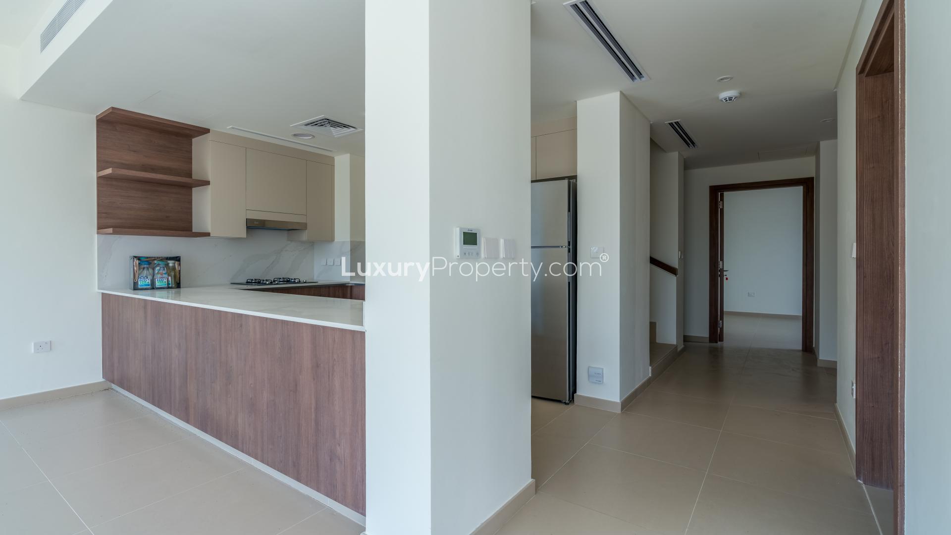 Modern kitchen in brand new Elan Villa, Tilal Al Ghaf, with sleek appliances