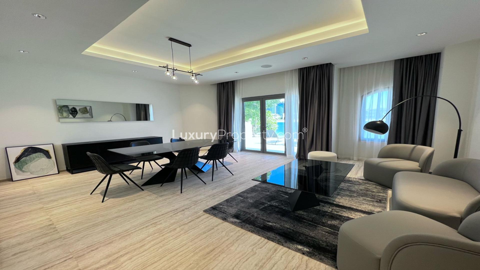 Modern living room in Palm Jumeirah villa with stylish decor and natural light