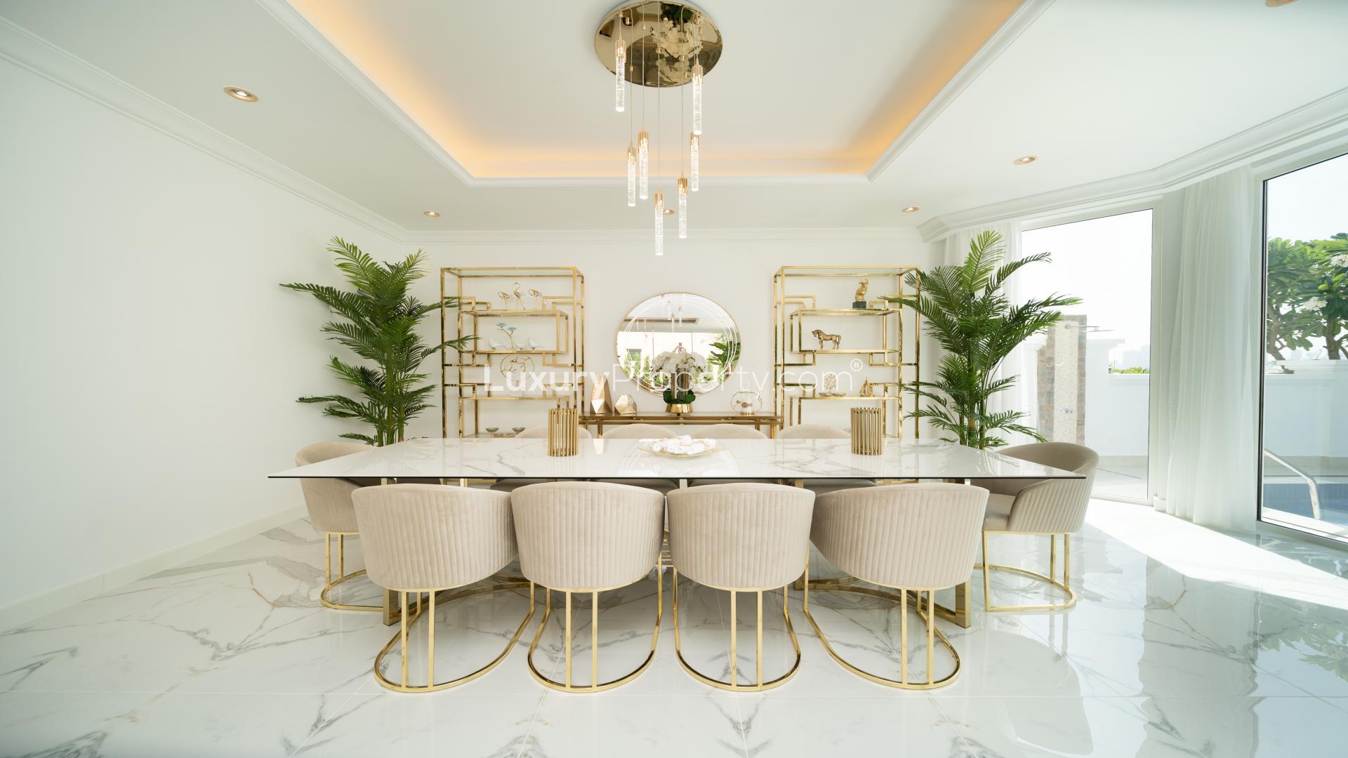 Luxurious living room in 5-bedroom villa, Palm Jumeirah, with elegant decor and garden view