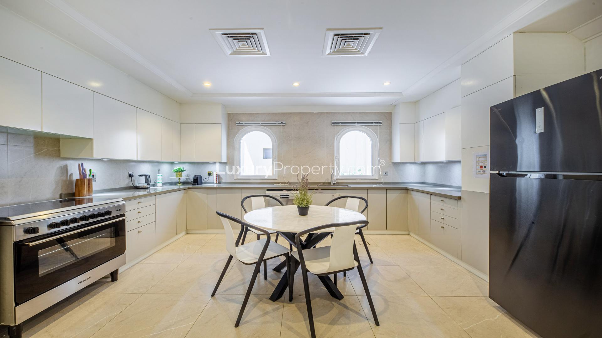 Luxurious dining room in upgraded Palm Jumeirah villa with marina views, elegant decor