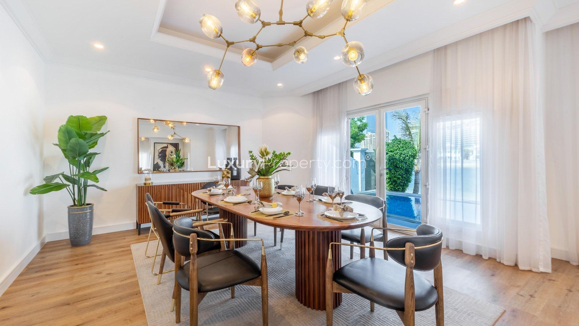 Luxurious living room in fully upgraded Palm Jumeirah villa with modern decor and art