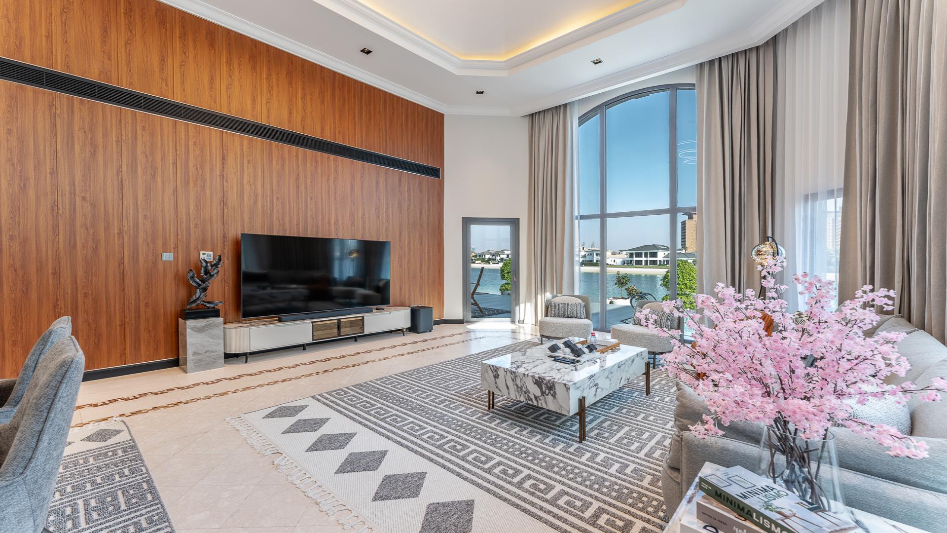 Bespoke beachfront villa exterior with palm trees, Palm Jumeirah Garden Homes, for rent