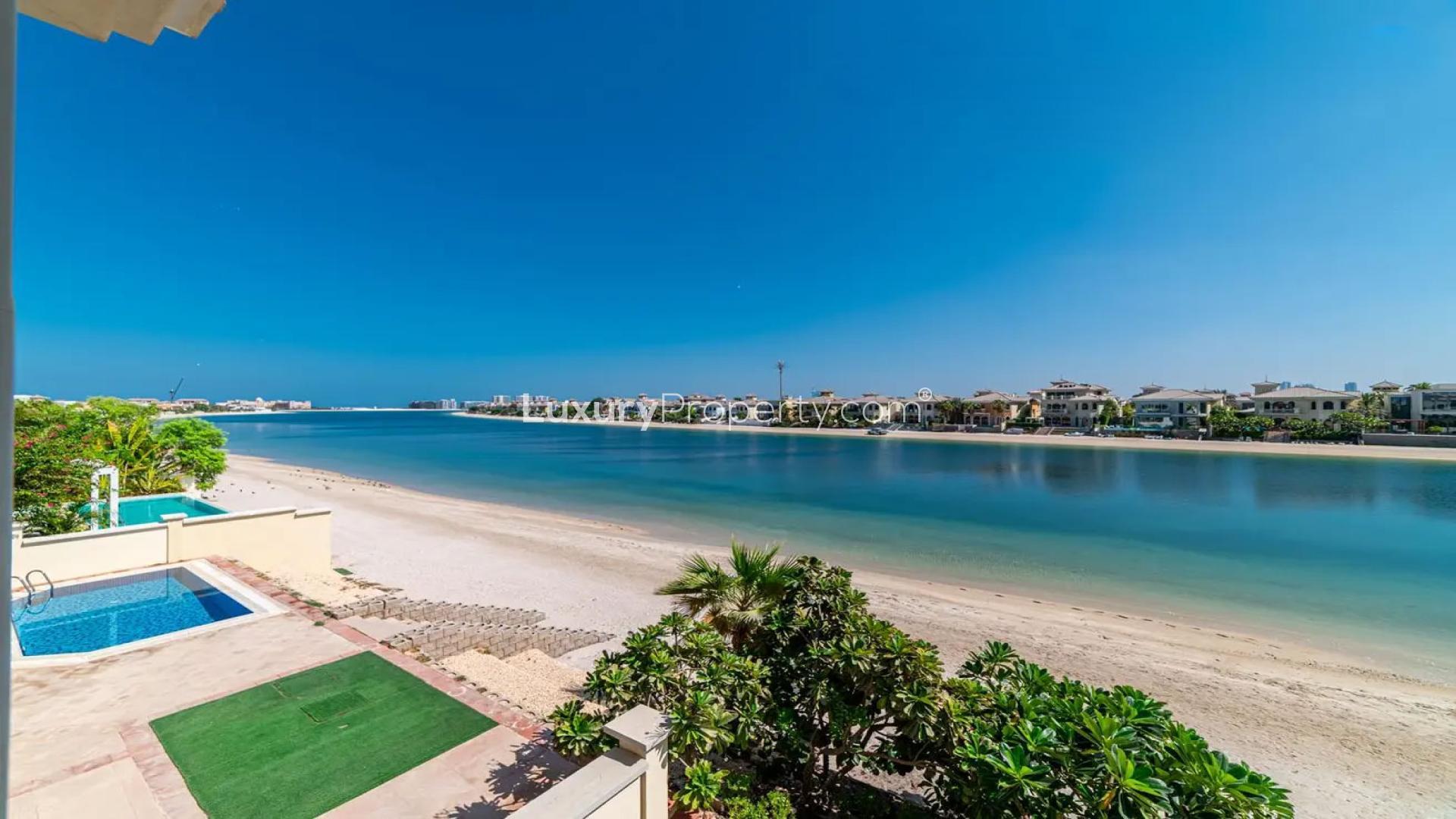 Spacious Palm Jumeirah villa interior with large windows and garden view, for rent