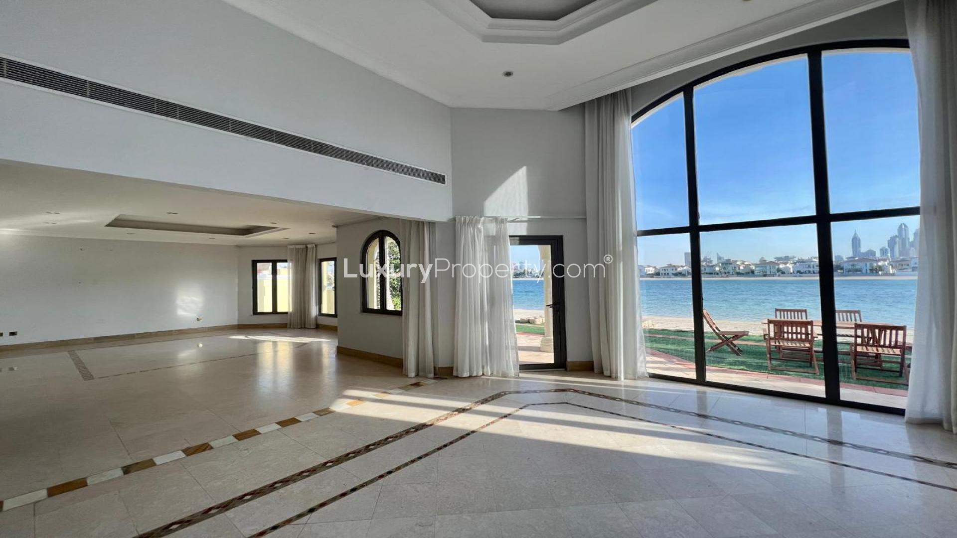 Outdoor pool at Frond B Villa, Palm Jumeirah, with waterfront view, available for rent
