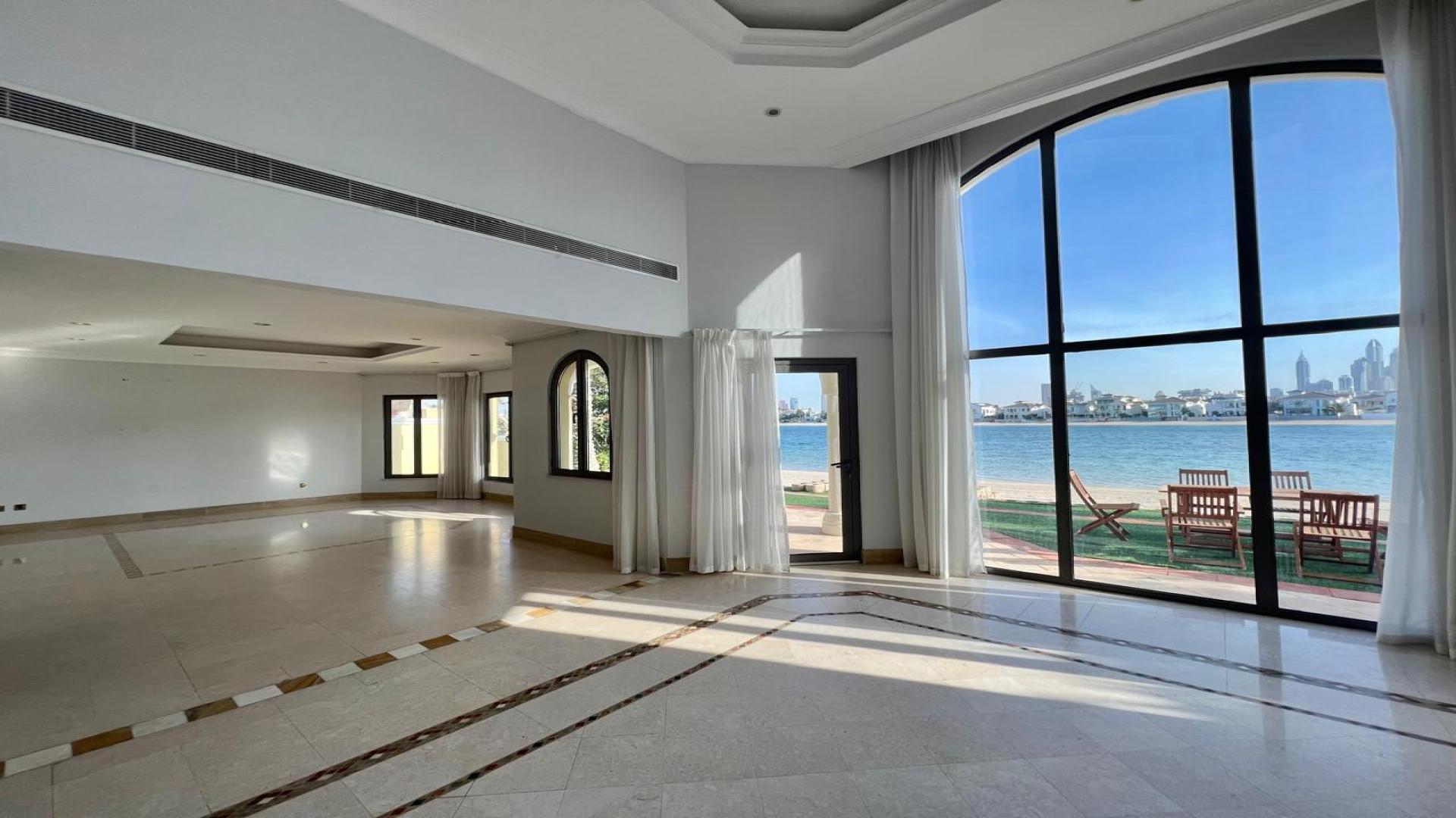 Outdoor pool at Frond B Villa, Palm Jumeirah, with waterfront view, available for rent