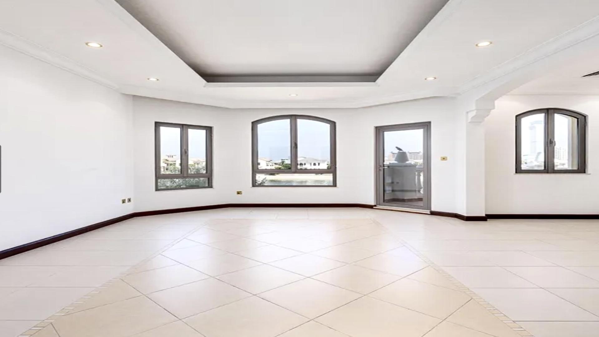 Luxurious beachfront villa interior with chandelier and pool view in Palm Jumeirah