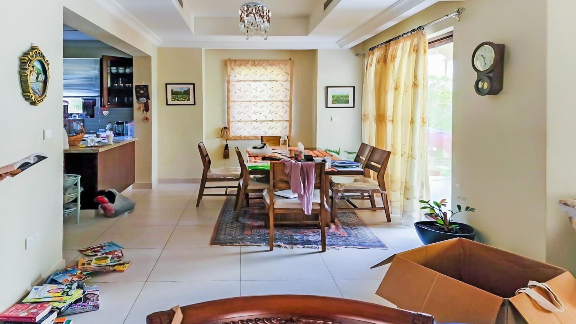 Elegant living room in spacious Arabian Ranches 2 villa, featuring plush sofas and decor