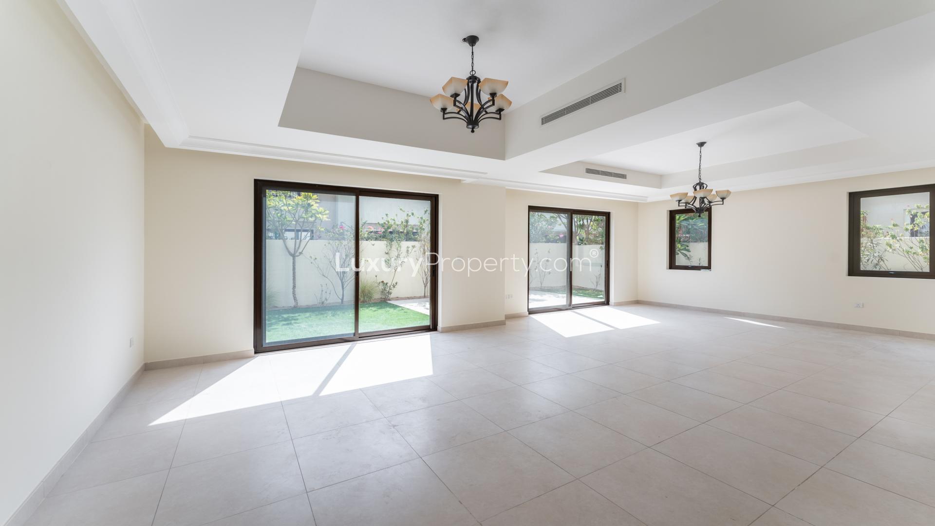 Spacious living room with large windows in Palma Villa, Arabian Ranches 2, Dubai