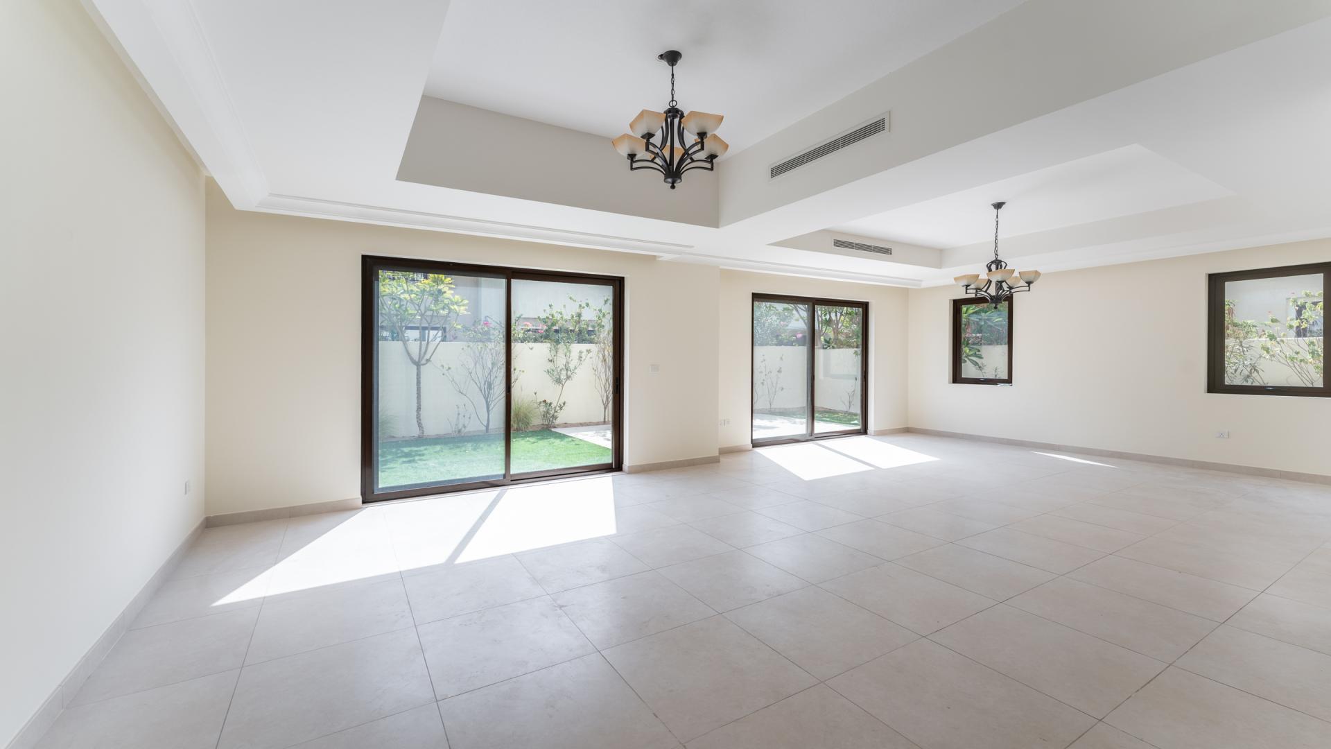 Spacious living room with large windows in Palma Villa, Arabian Ranches 2, Dubai