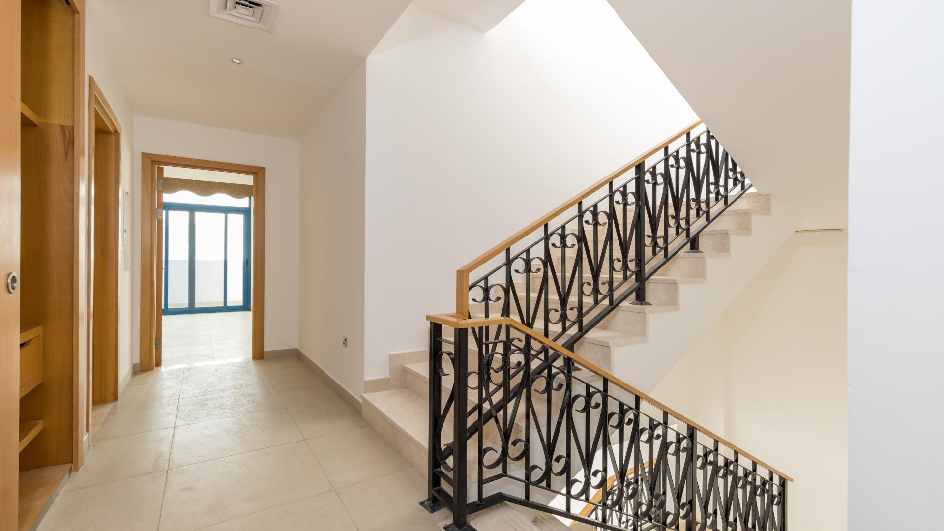 Spacious interior of Greek-style villa with elegant staircase, Palma Residences, Palm Jumeirah