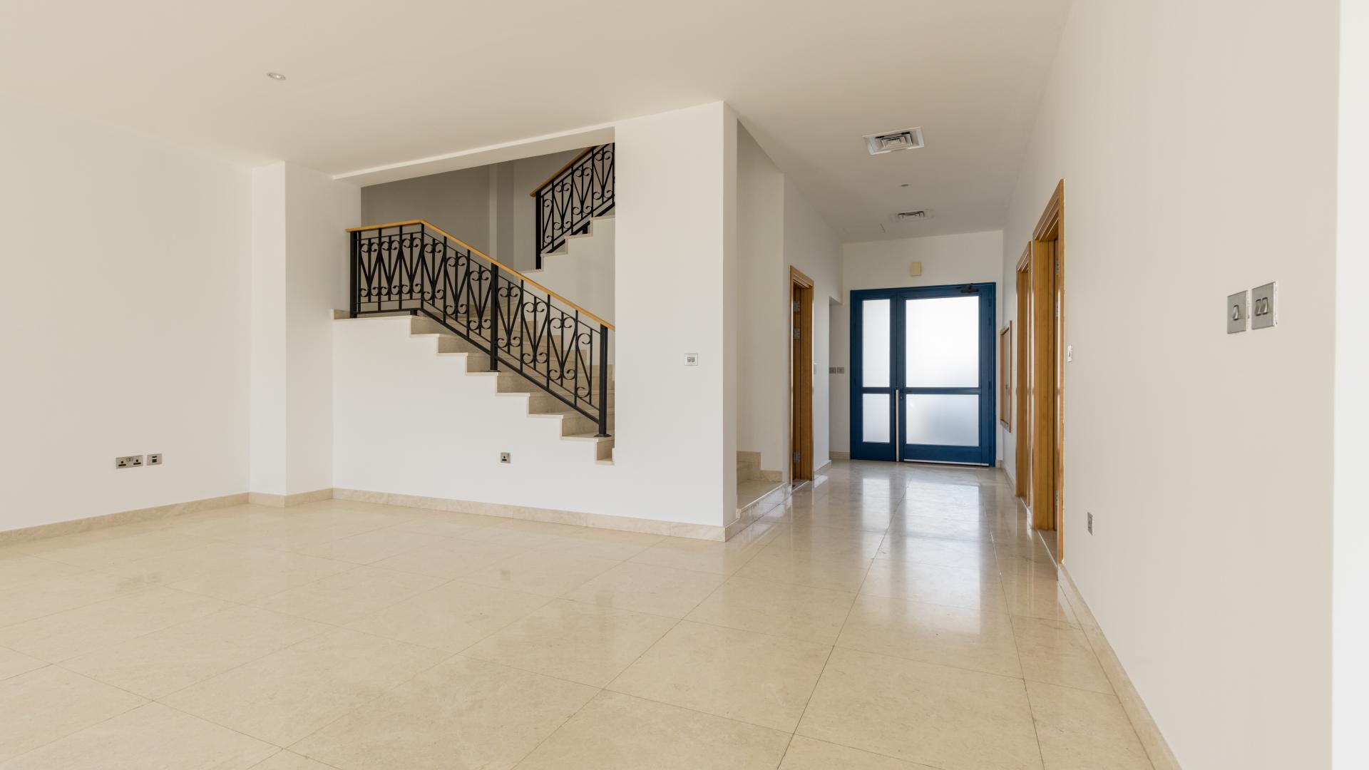 Spacious living room with large windows in Greek-style villa, Palm Jumeirah, Palma Residences