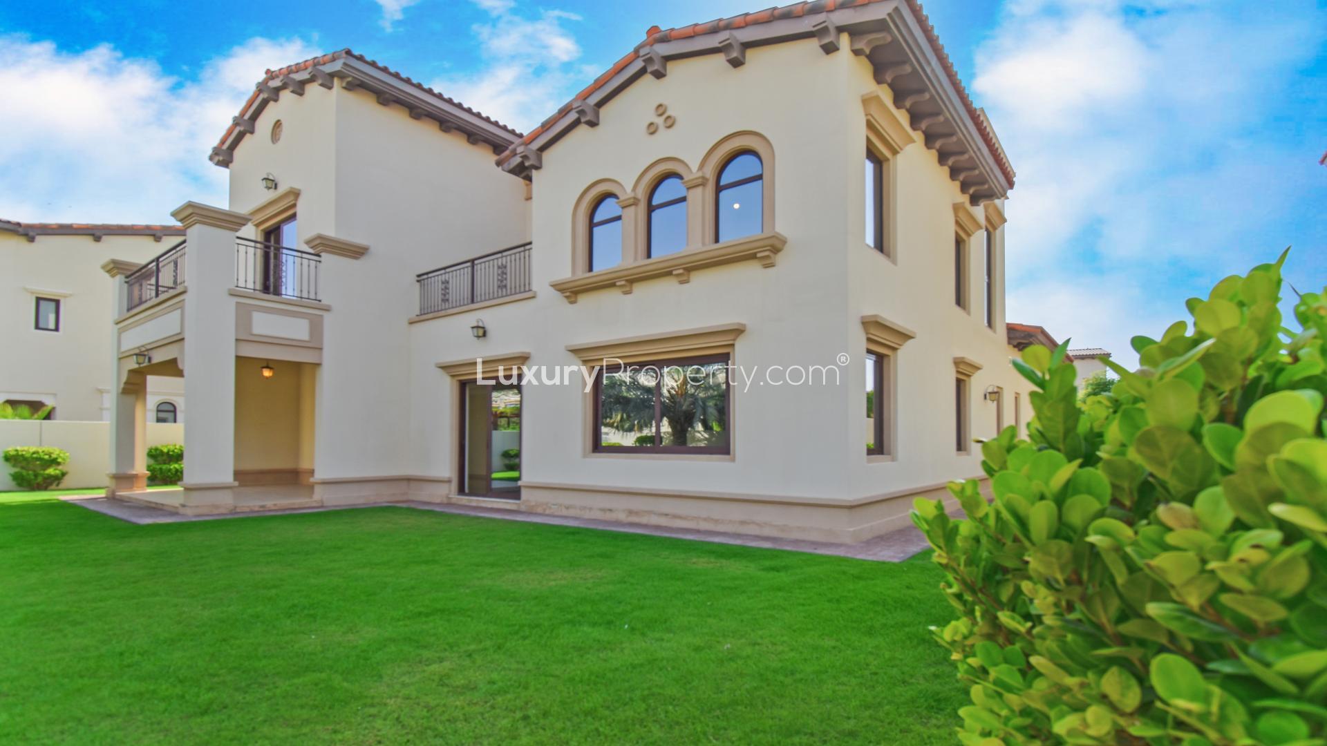 Spacious living room in Rasha villa, Arabian Ranches 2, with large windows and garden view