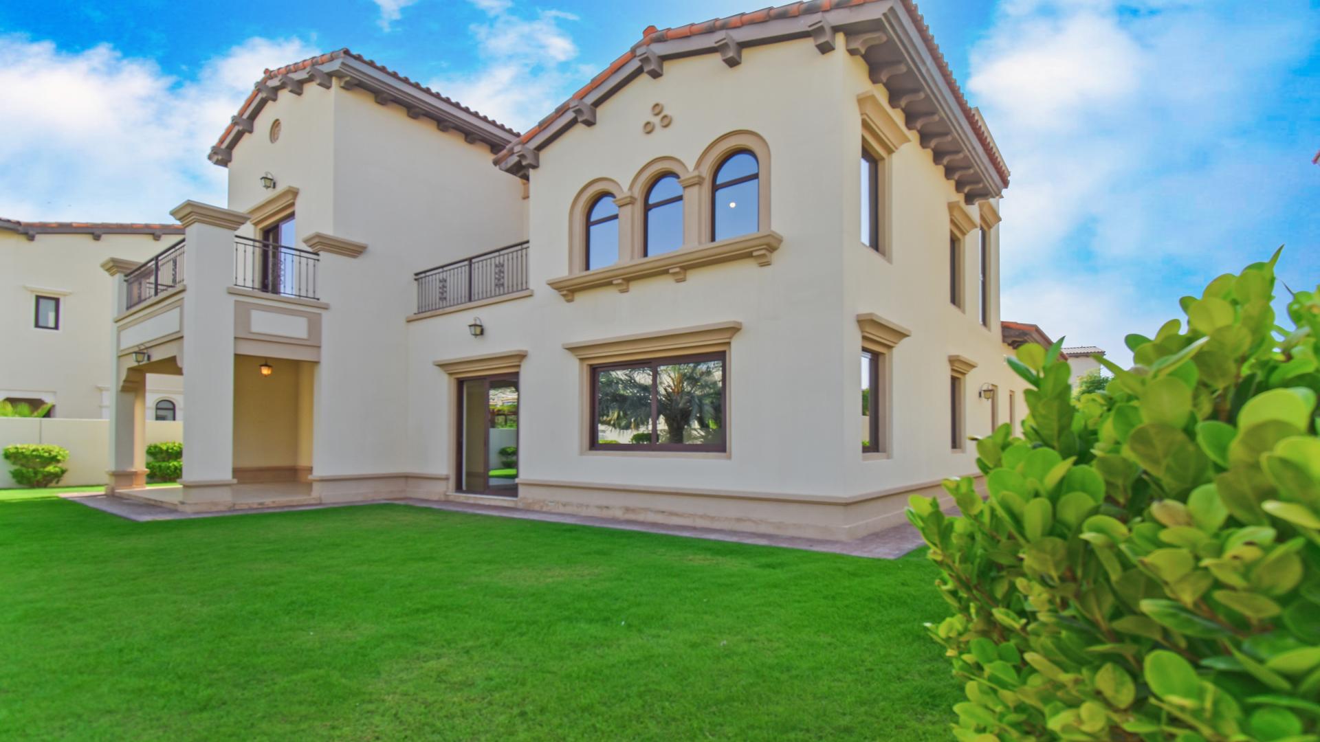 Spacious living room in Rasha villa, Arabian Ranches 2, with large windows and garden view