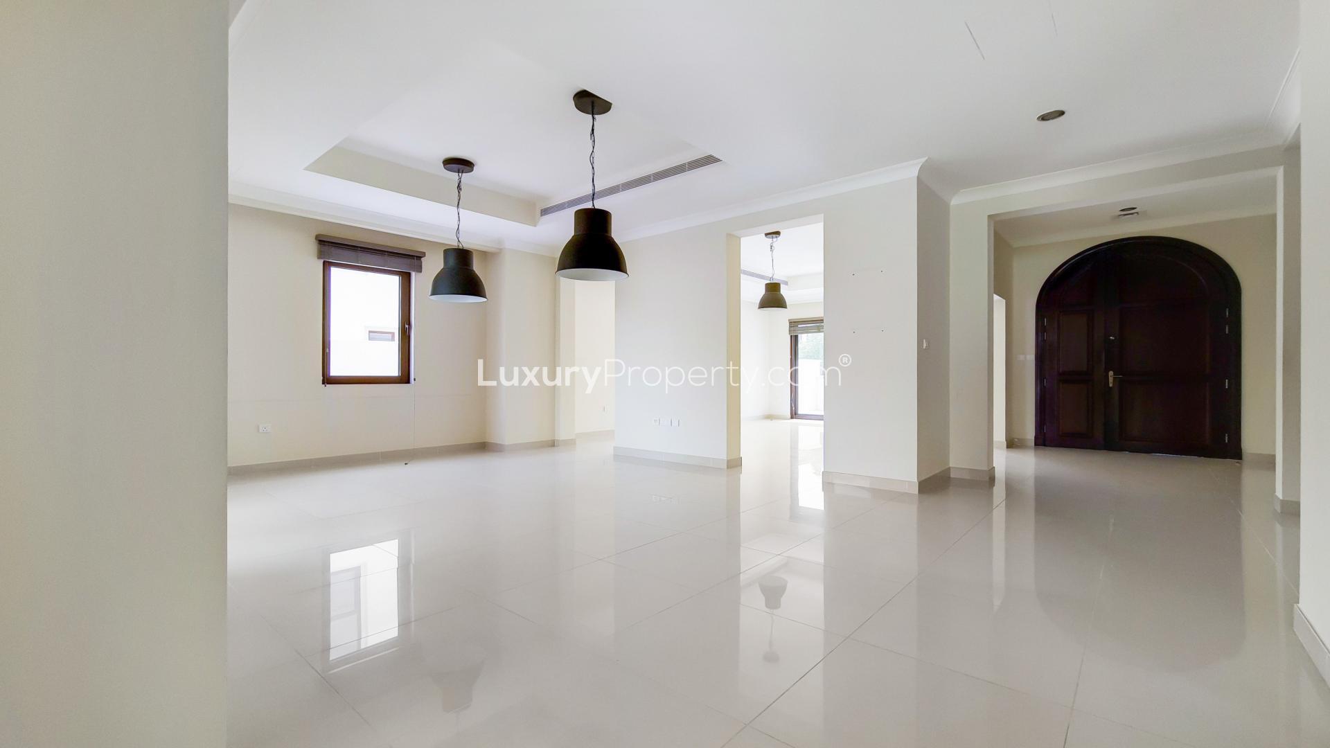 "Spacious bedroom in Rasha villa, Arabian Ranches 2, available for rent, vacant now.",Spacious kitchen with wooden cabinets and granite countertops in Rasha villa, Arabian Ranches 2