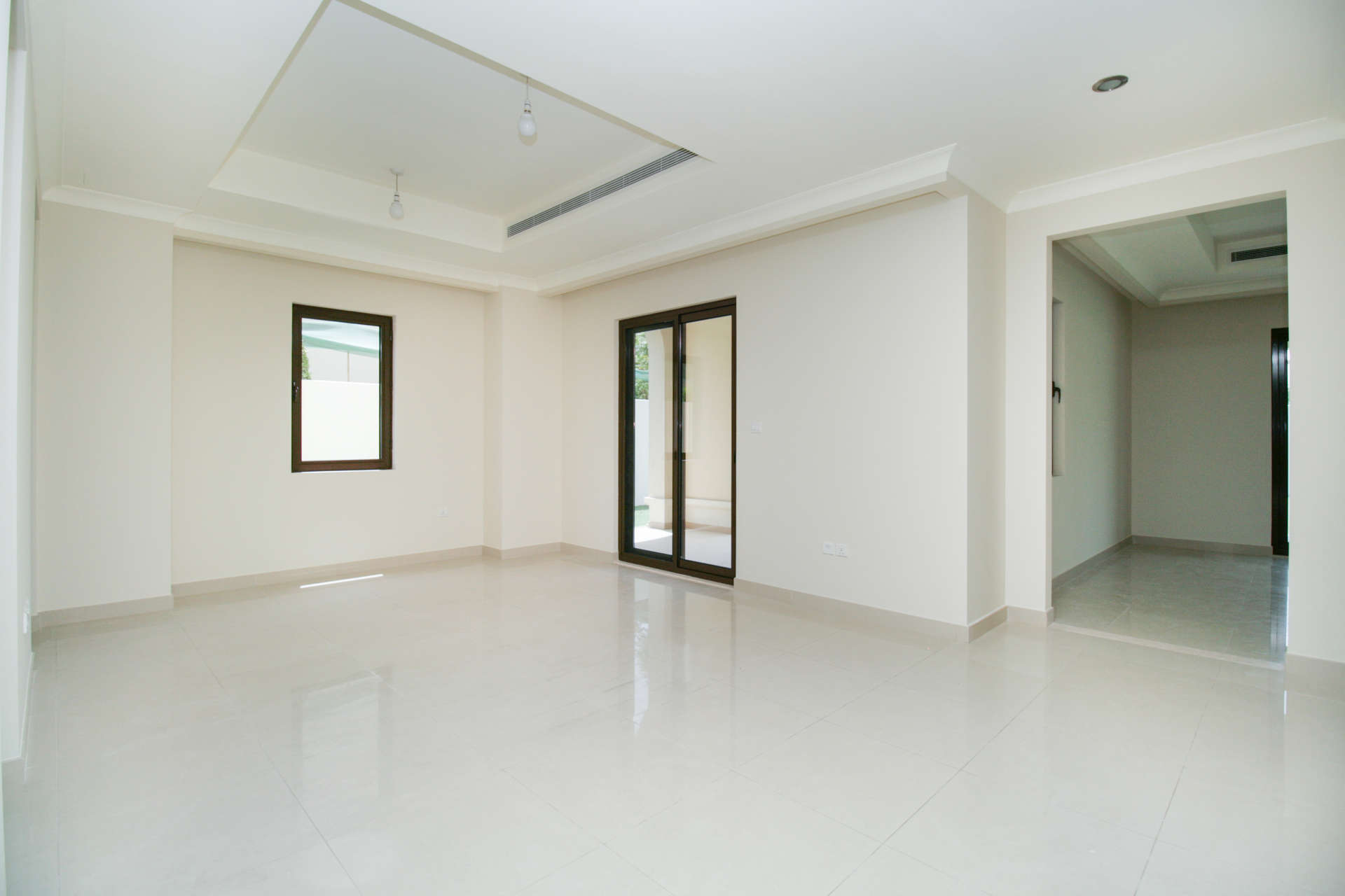 Empty living room with large windows in Rasha villa, Arabian Ranches 2, for rent