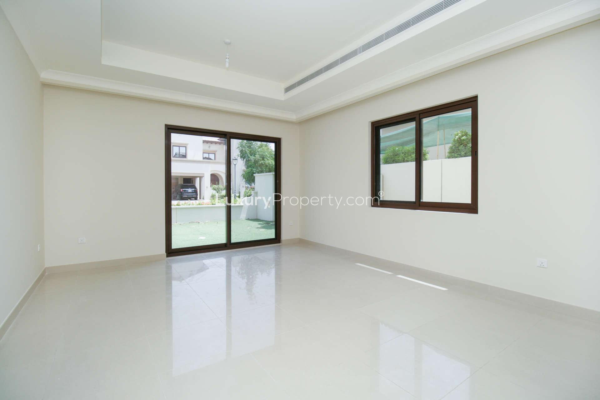Empty living room with large sliding doors in Rasha villa, Arabian Ranches 2
