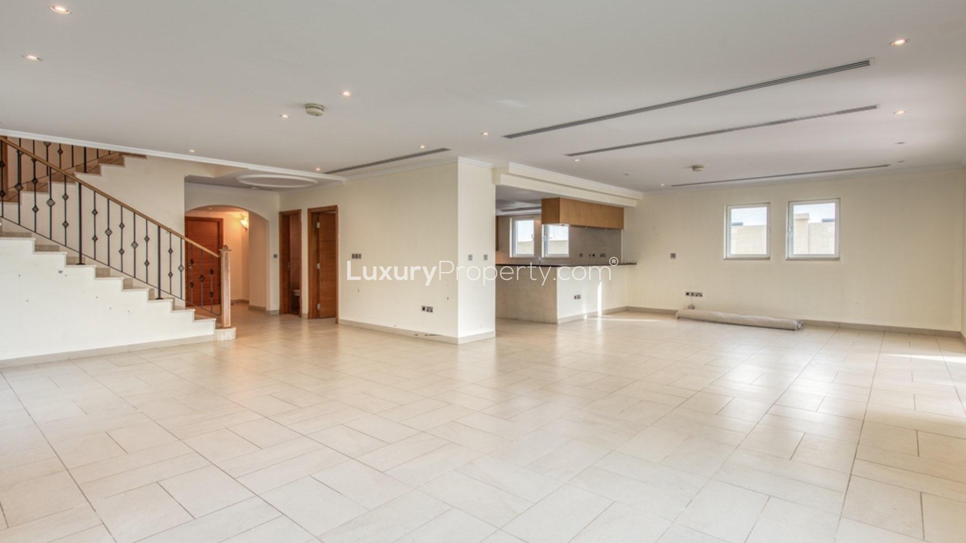 Spacious living room with large windows in Jumeirah Park villa for rent