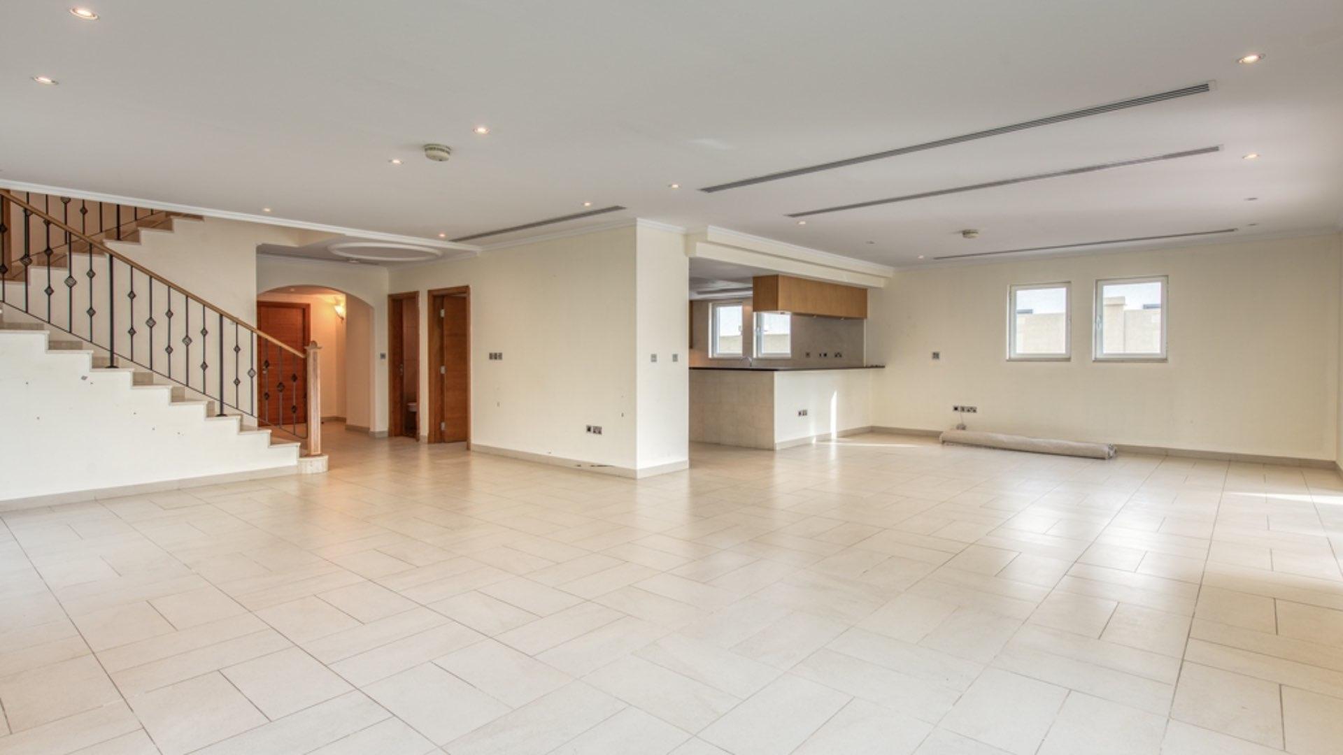 Spacious living room with large windows in Jumeirah Park villa for rent