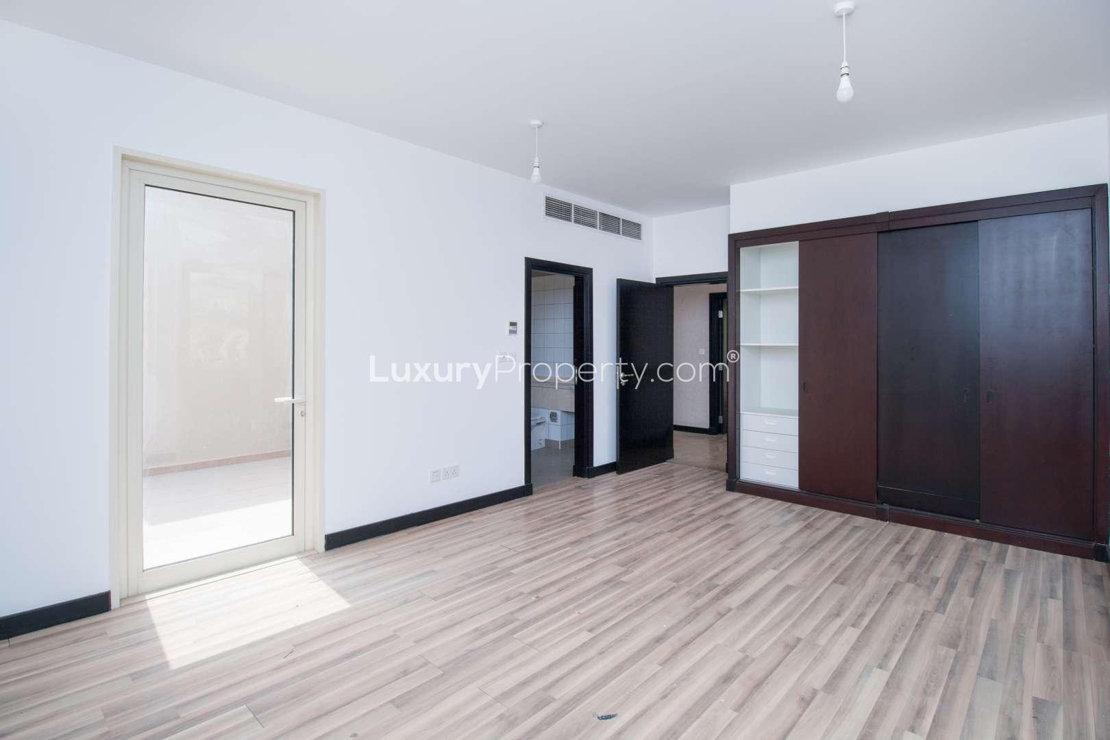 Tree-lined street view in Saheel, Arabian Ranches, near 4-bedroom villa for rent