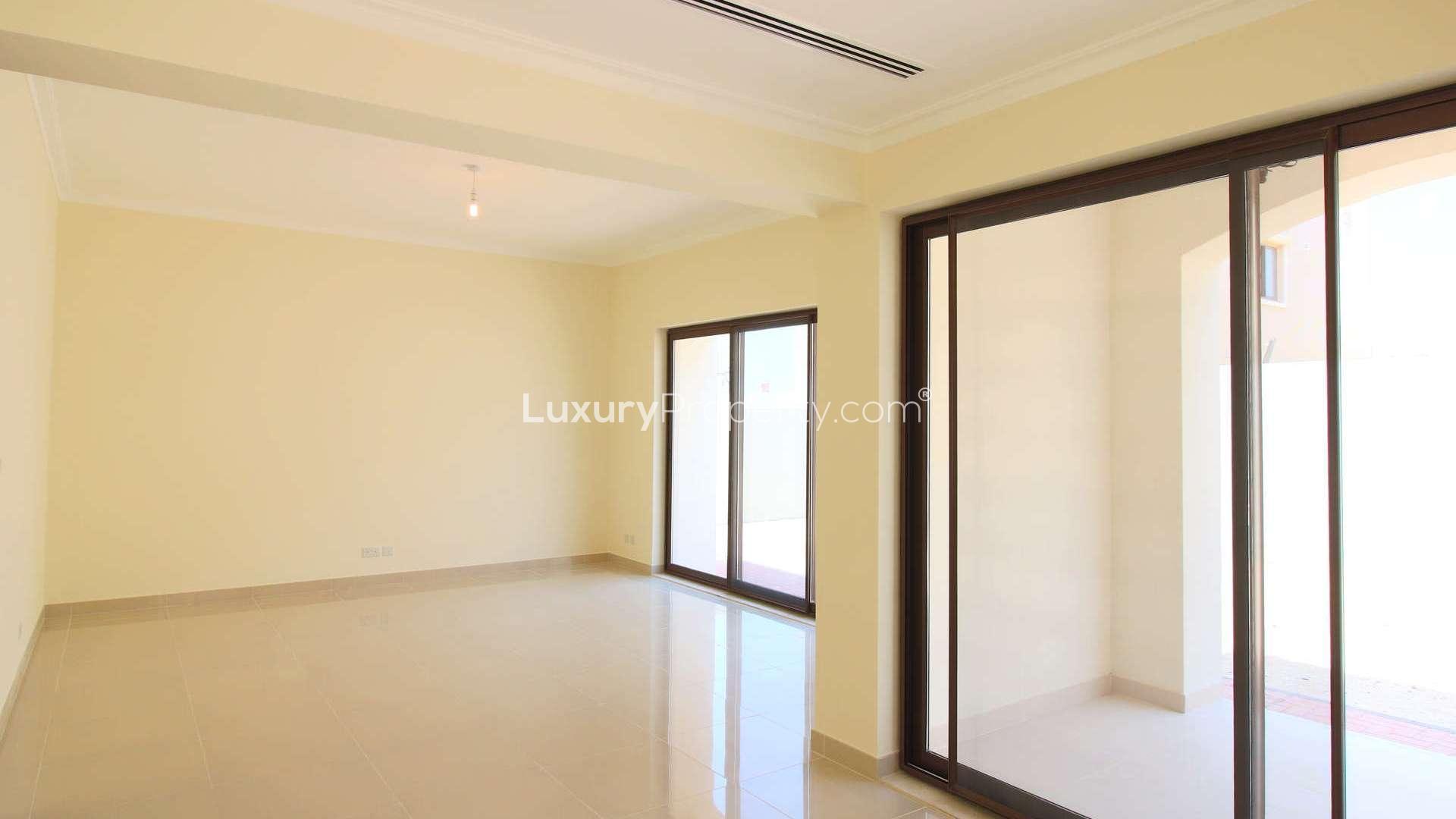 Spacious living room in modern Samara villa, Arabian Ranches 2, with large windows and natural light