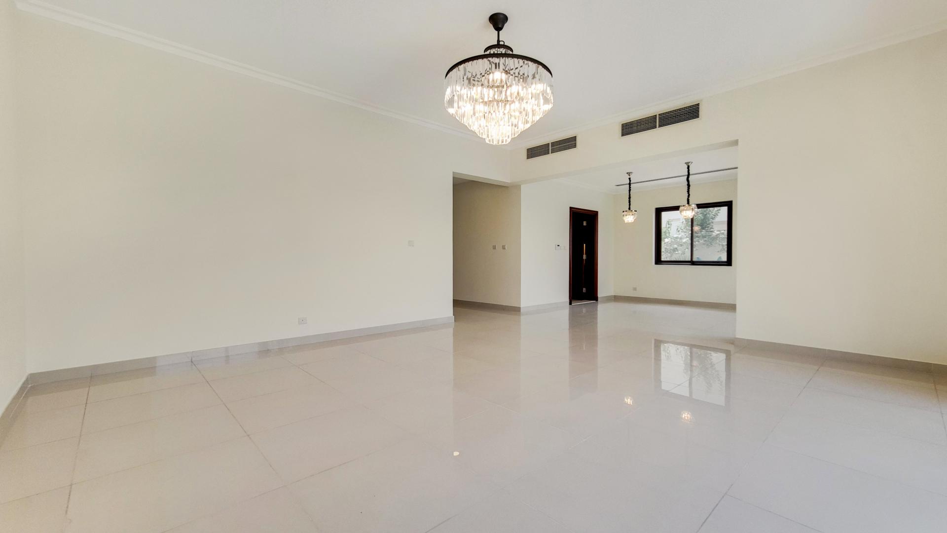Spacious living area with elegant chandelier in Samara, Arabian Ranches 2 villa for rent
