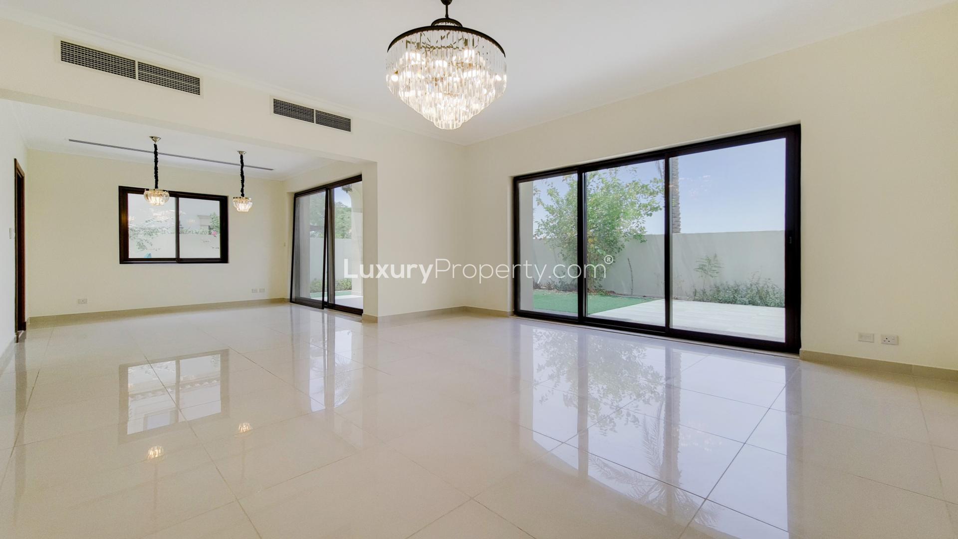 "Front view of four-bedroom villa with garage in Samara, Arabian Ranches 2 for rent.",Spacious living area in four-bedroom villa, Samara, Arabian Ranches 2, with garden view