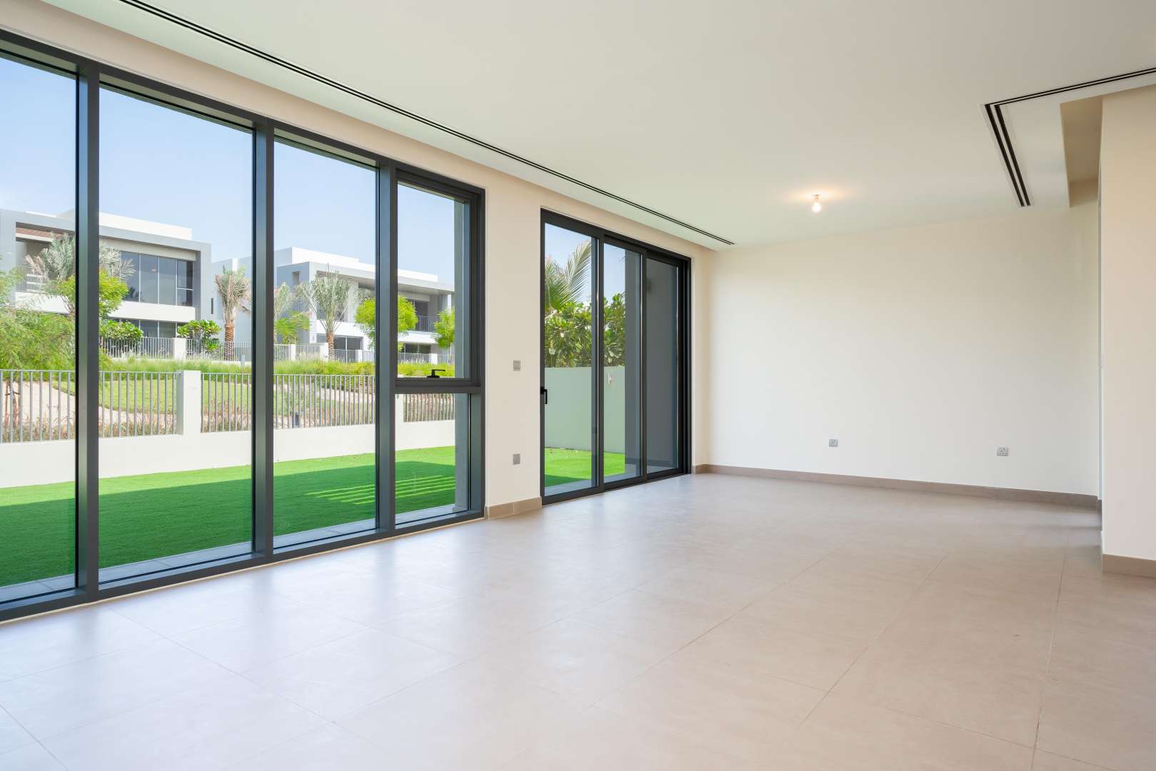 Bright living room with large windows in Dubai Hills Estate villa for rent