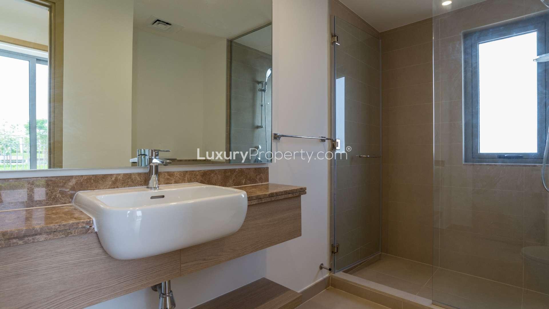 Empty bedroom with built-in wooden wardrobe in Sidra 3 Villa, Dubai Hills Estate