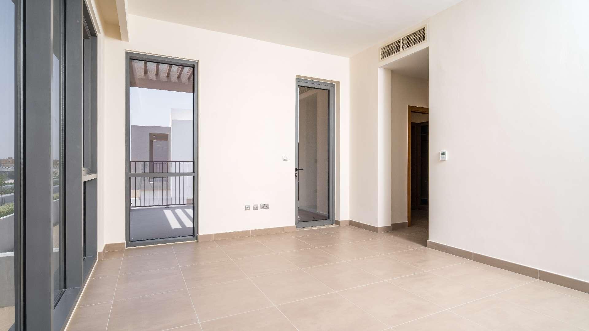 Empty room in Sidra Villas, Dubai Hills Estate, featuring modern finishes and large windows